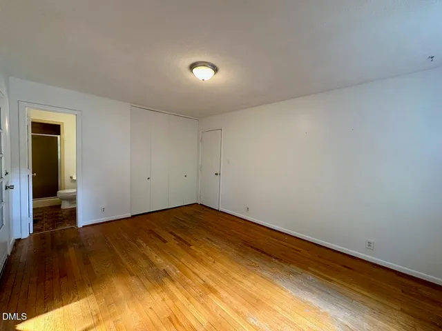 a bathroom with a sink mirror and toilet