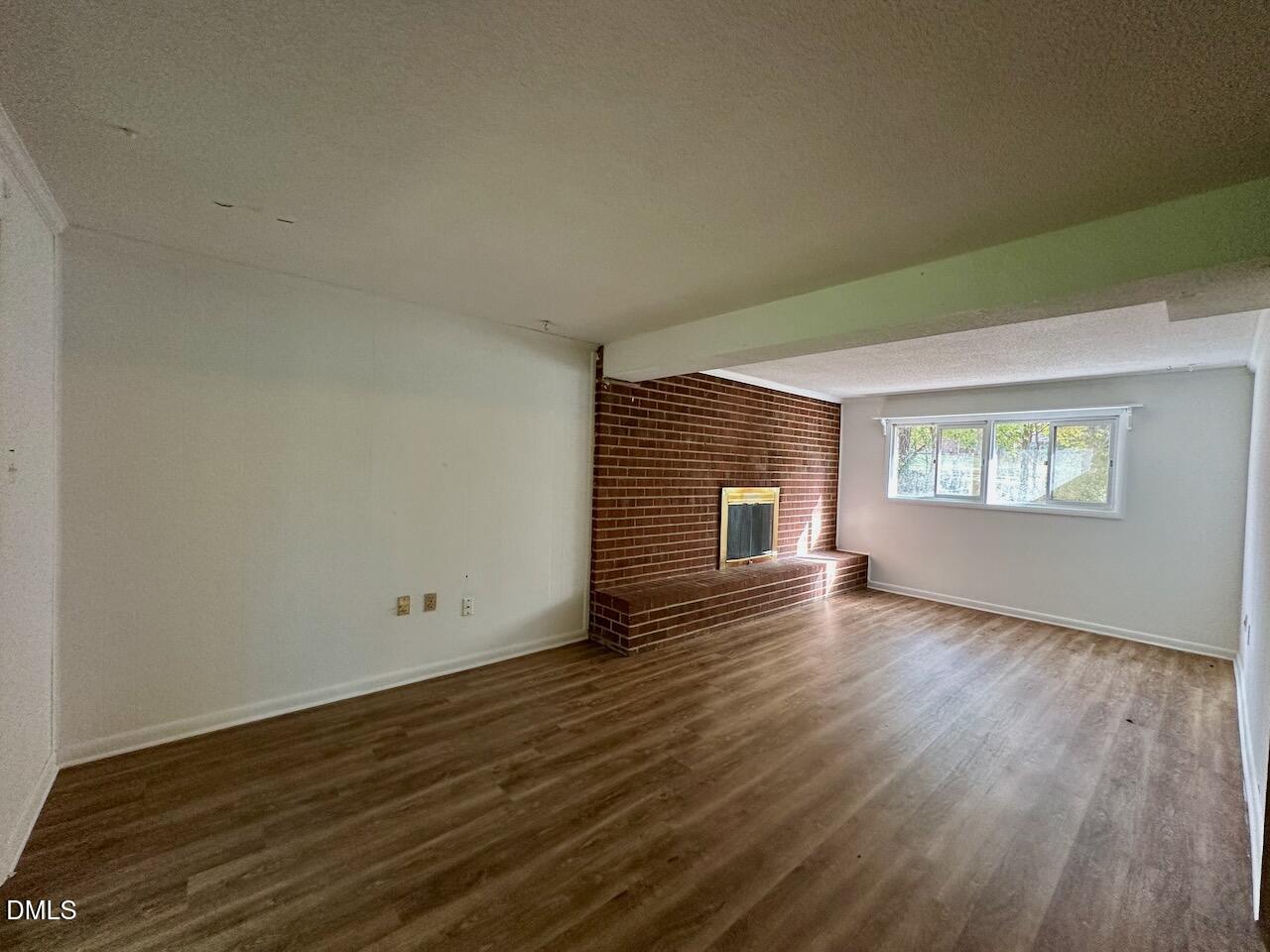 3421 Huntleigh Drive Raleigh, NC 27604 - Photo 20 of 27 an empty room with wooden floor and windows