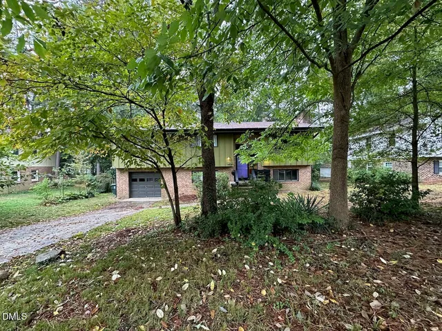 a backyard of a house with lots of green space