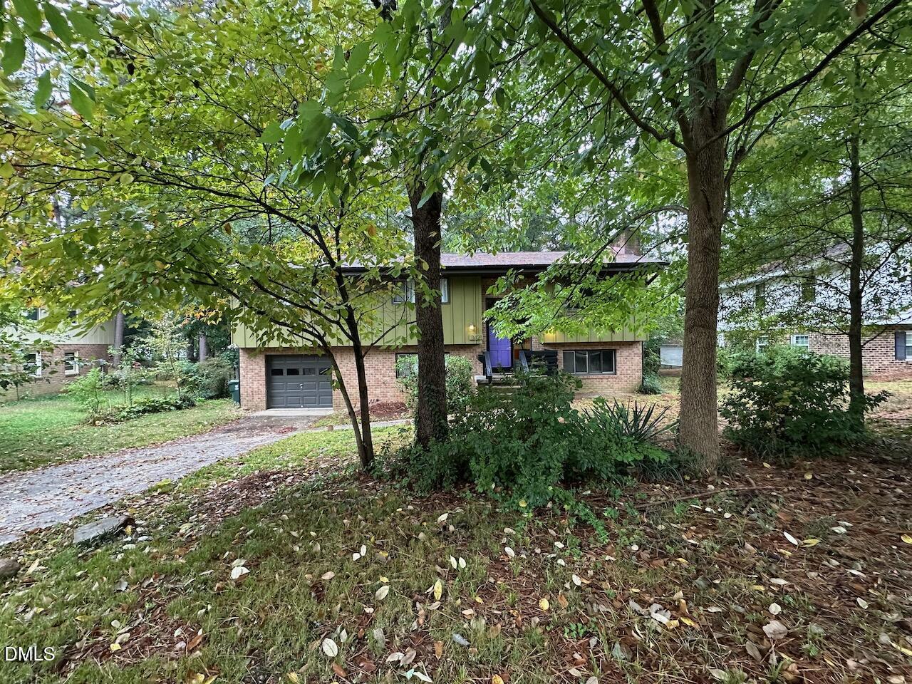 3421 Huntleigh Drive Raleigh, NC 27604 - Photo 3 of 27 a backyard of a house with lots of green space