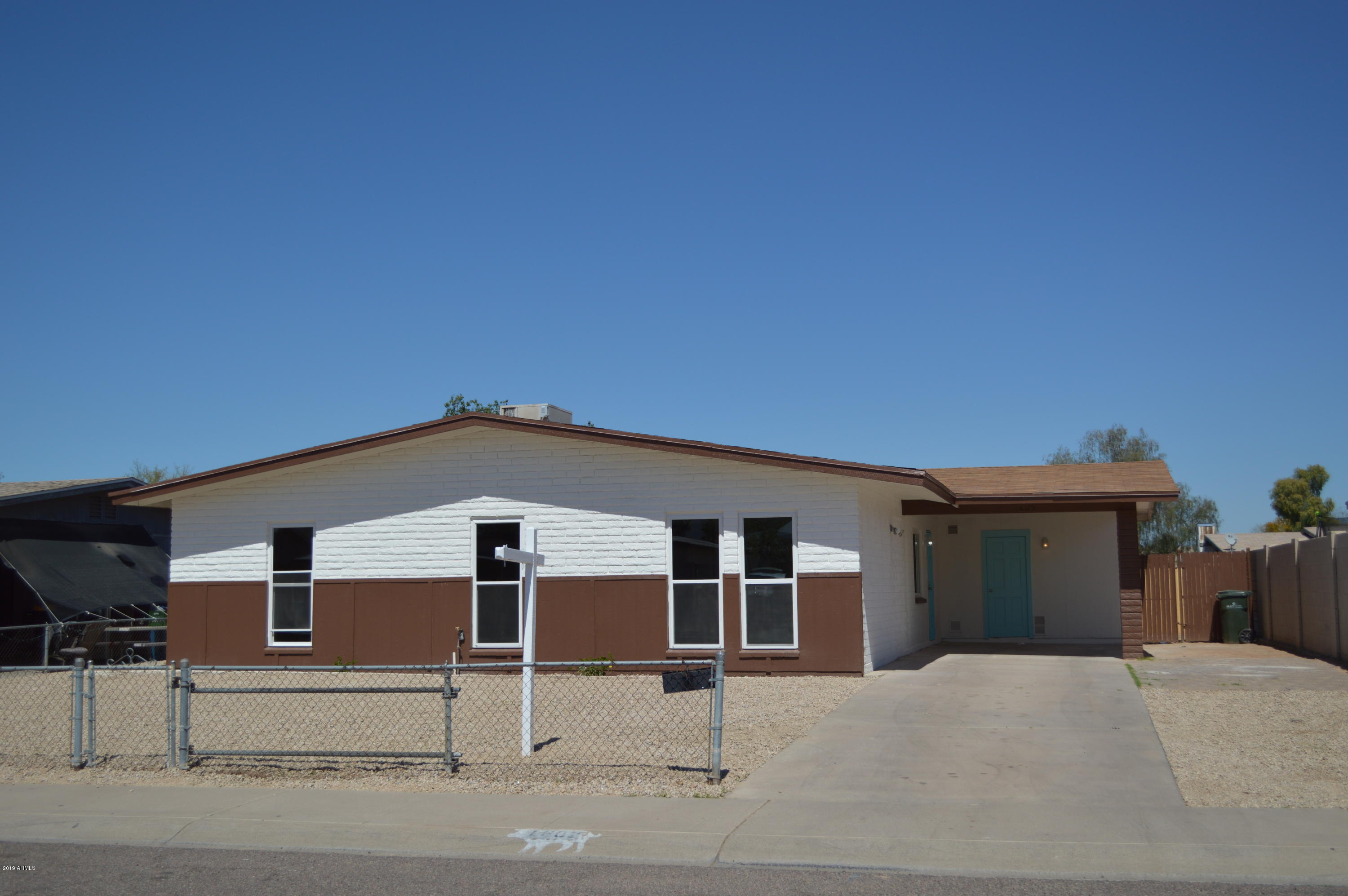 1602 West Darrel Road Phoenix, AZ 85041 - Photo 1 of 39 front view of a house with street