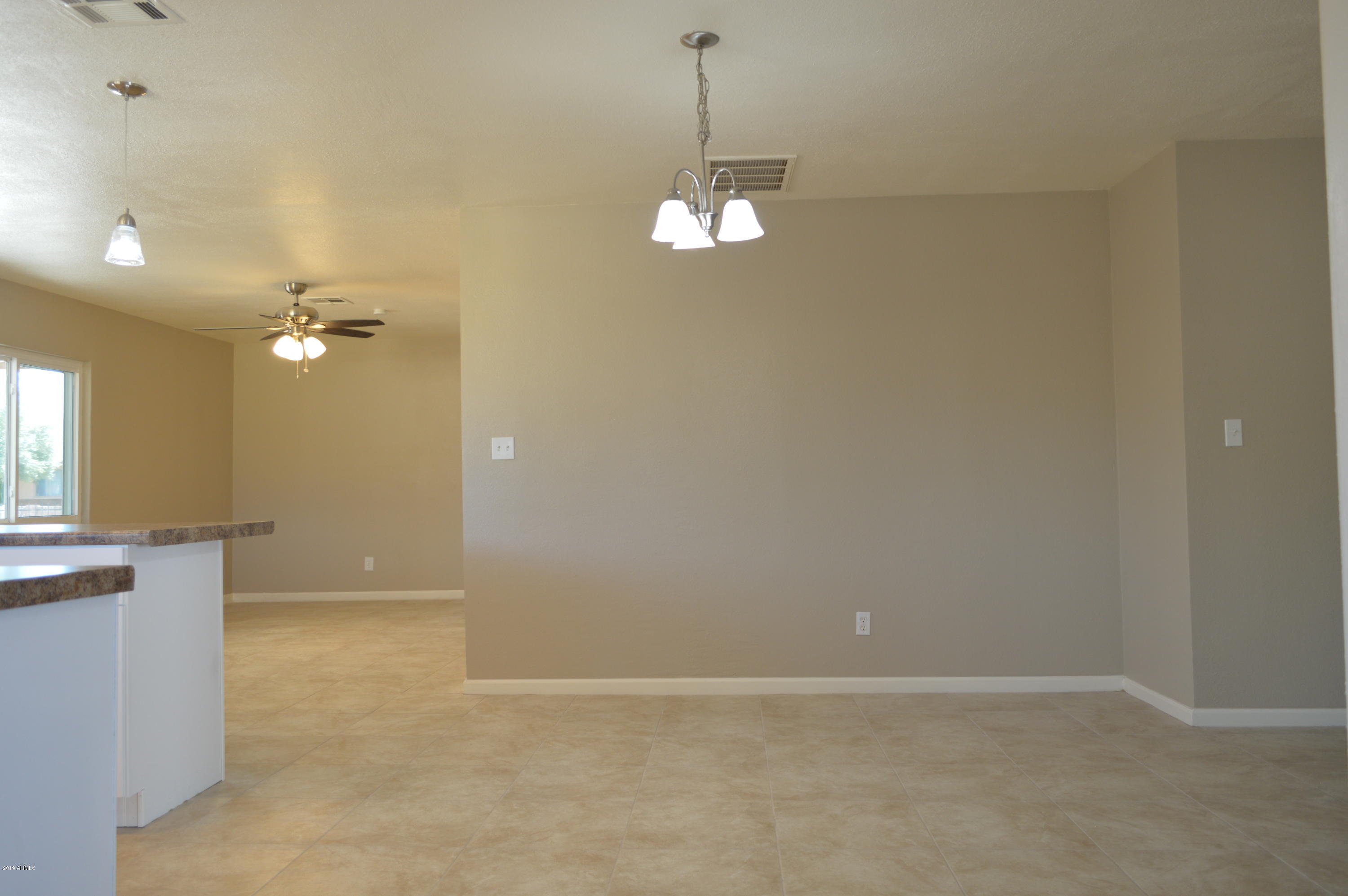 1602 West Darrel Road Phoenix, AZ 85041 - Photo 13 of 39 a view of an empty room with a window