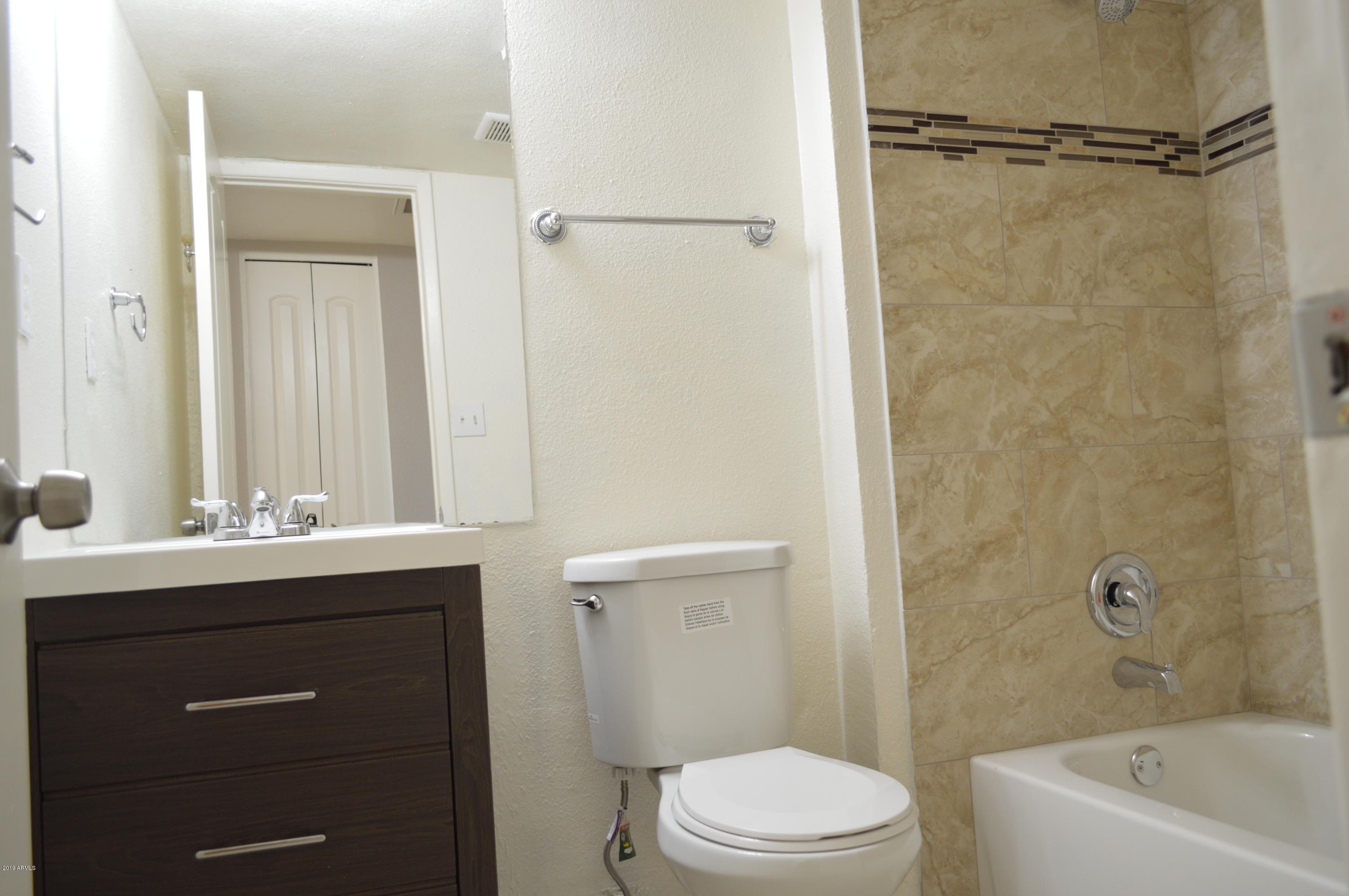 1602 West Darrel Road Phoenix, AZ 85041 - Photo 27 of 39 a bathroom with a sink a toilet and shower