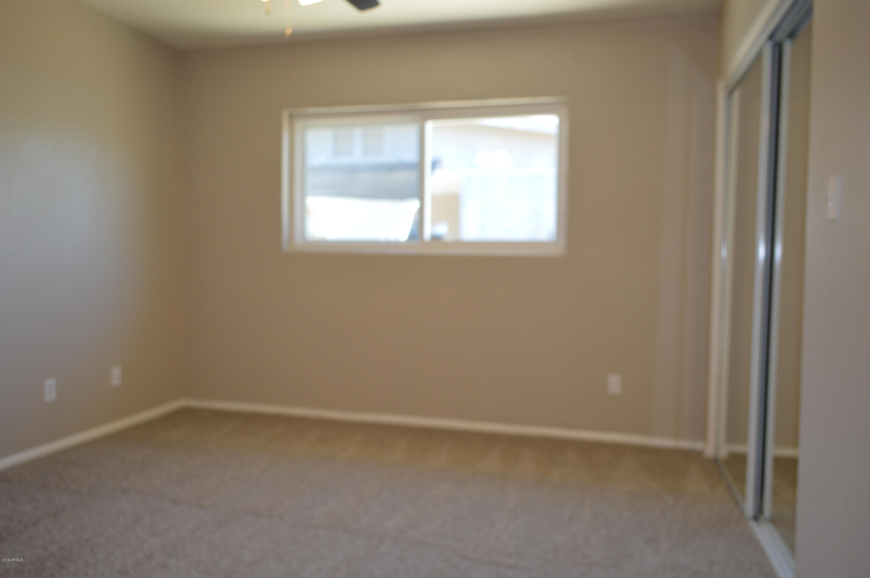1602 West Darrel Road Phoenix, AZ 85041 - Photo 29 of 39 an empty room with a window