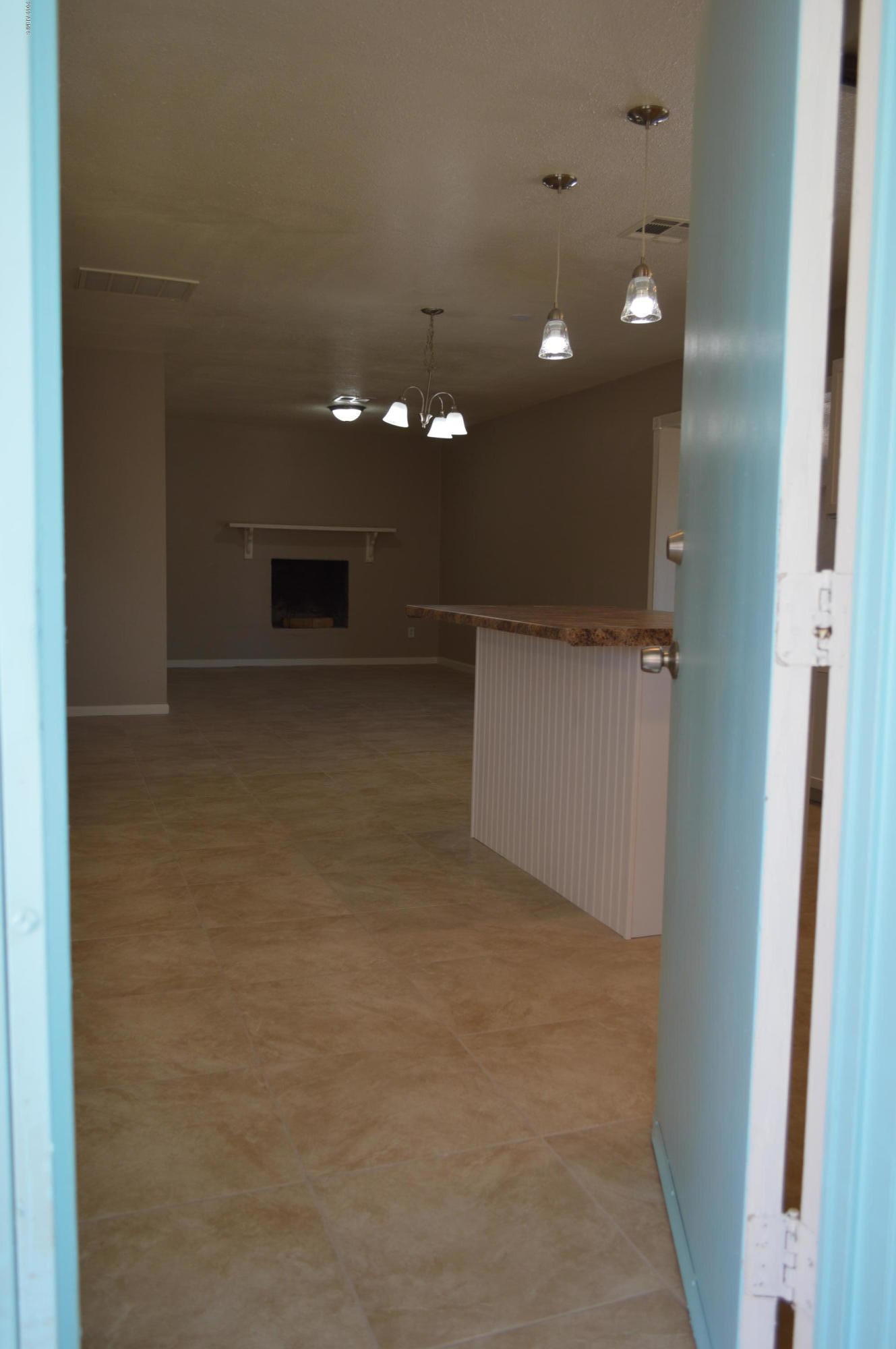1602 West Darrel Road Phoenix, AZ 85041 - Photo 6 of 39 a view of a hallway with an empty space