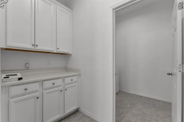 a view of cabinets with white cabinets