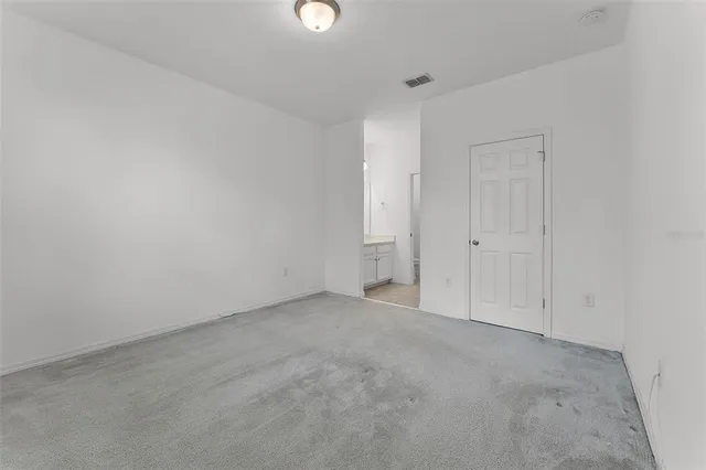 a bathroom with a sink shower and a mirror