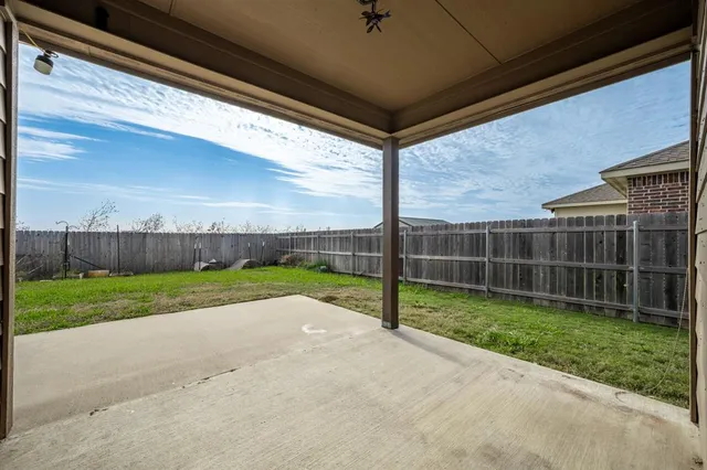 a view of backyard with green space