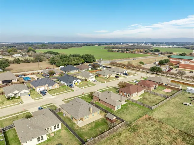 an aerial view of residential building and ocean