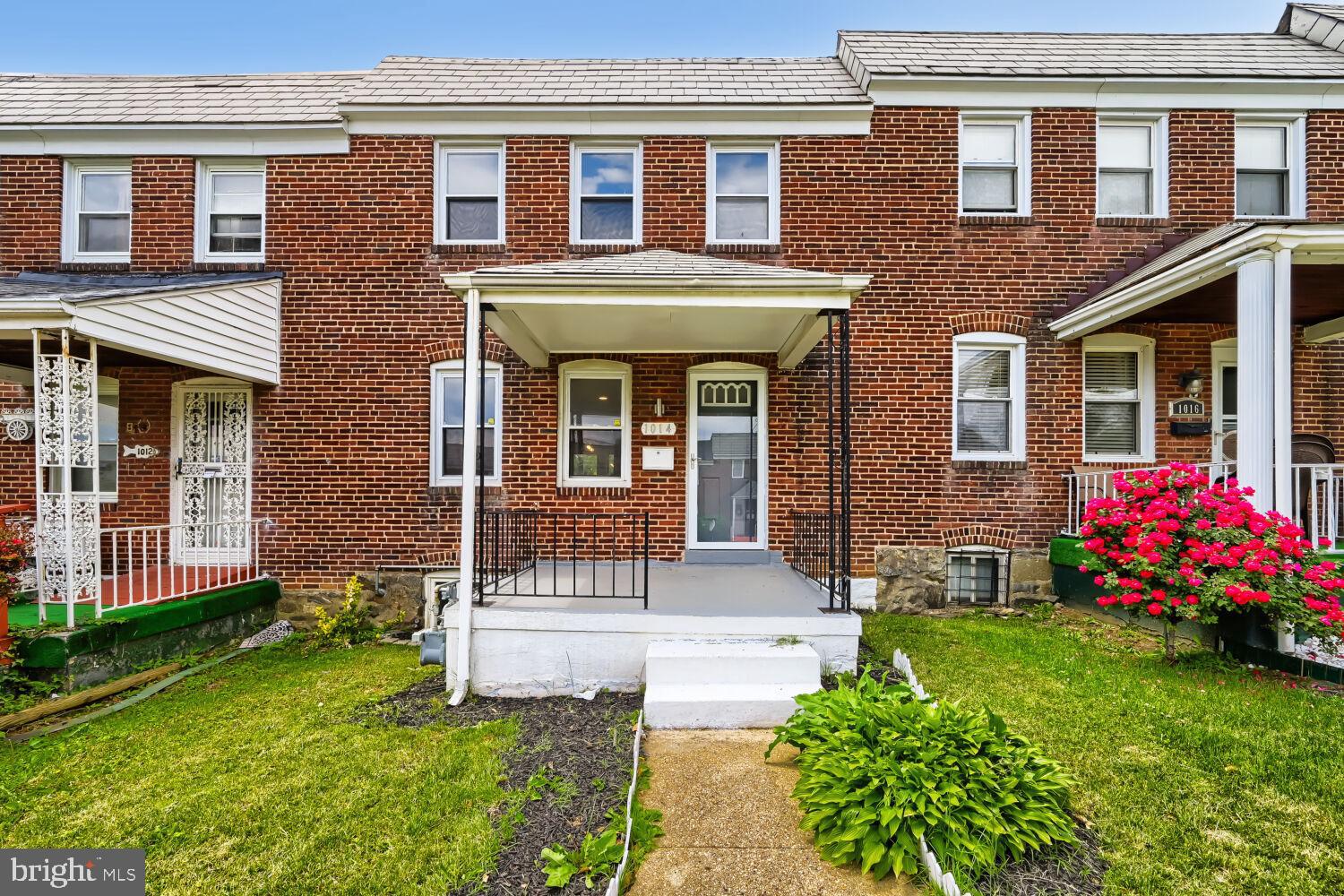 1014 Lyndhurst Street Baltimore, MD 21229 - Photo 3 of 29 a front view of a house with garden