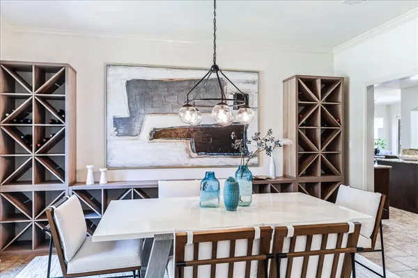 a dining room with furniture and wooden floor
