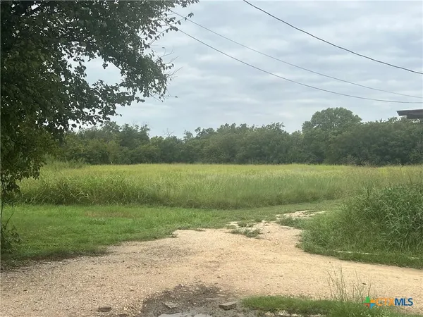 a view of a lake with a big yard