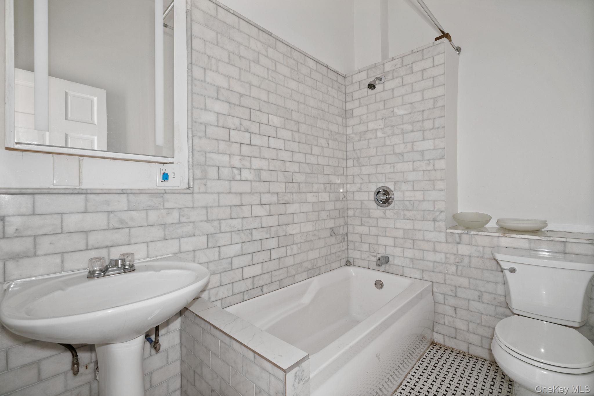 77 Academy Street Poughkeepsie, NY 12601 - Photo 12 of 30 Bathroom with tile walls and shower / washtub combination