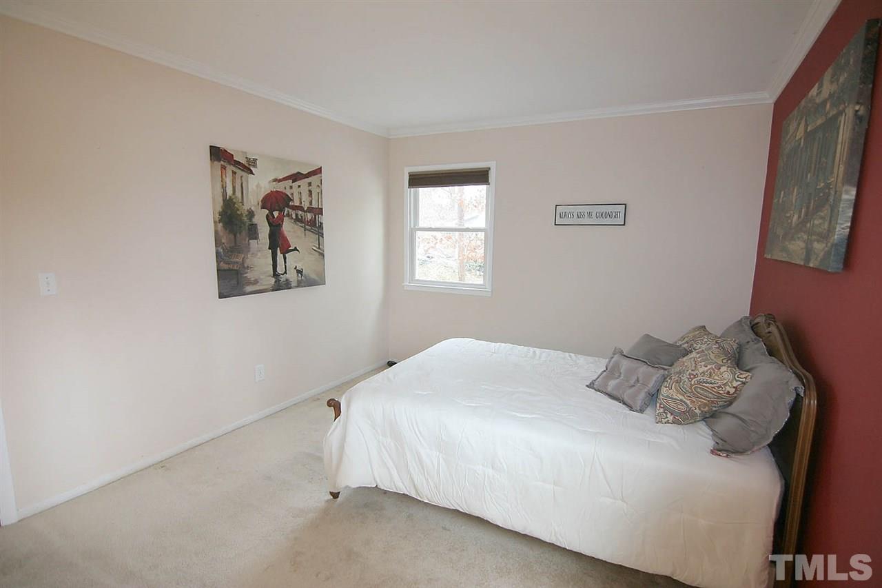 5405 Pelham Road Durham, NC 27713 - Photo 14 of 25 a bedroom with a bed and a window