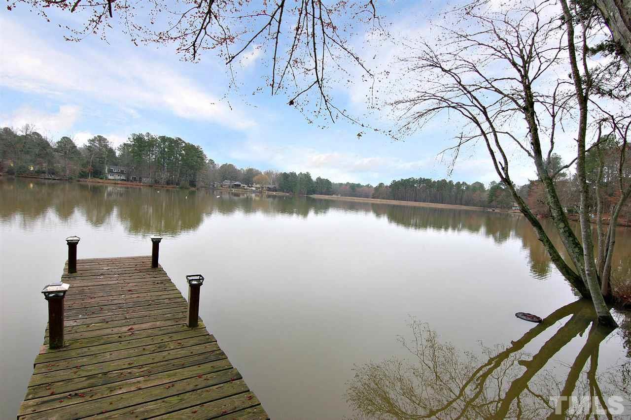 5405 Pelham Road Durham, NC 27713 - Photo 3 of 25 a lake view with a wooden bridge