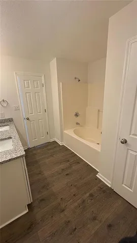 an empty room with wooden floor