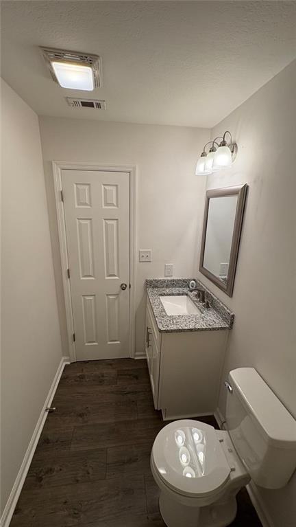 1289 Huntly Circle Thomson, GA 30824 - Photo 19 of 20 a bathroom with a toilet a sink and mirror
