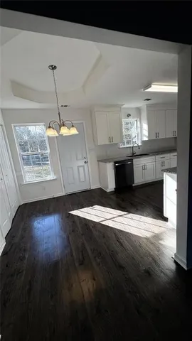 a view of a room with wooden floor and staircase