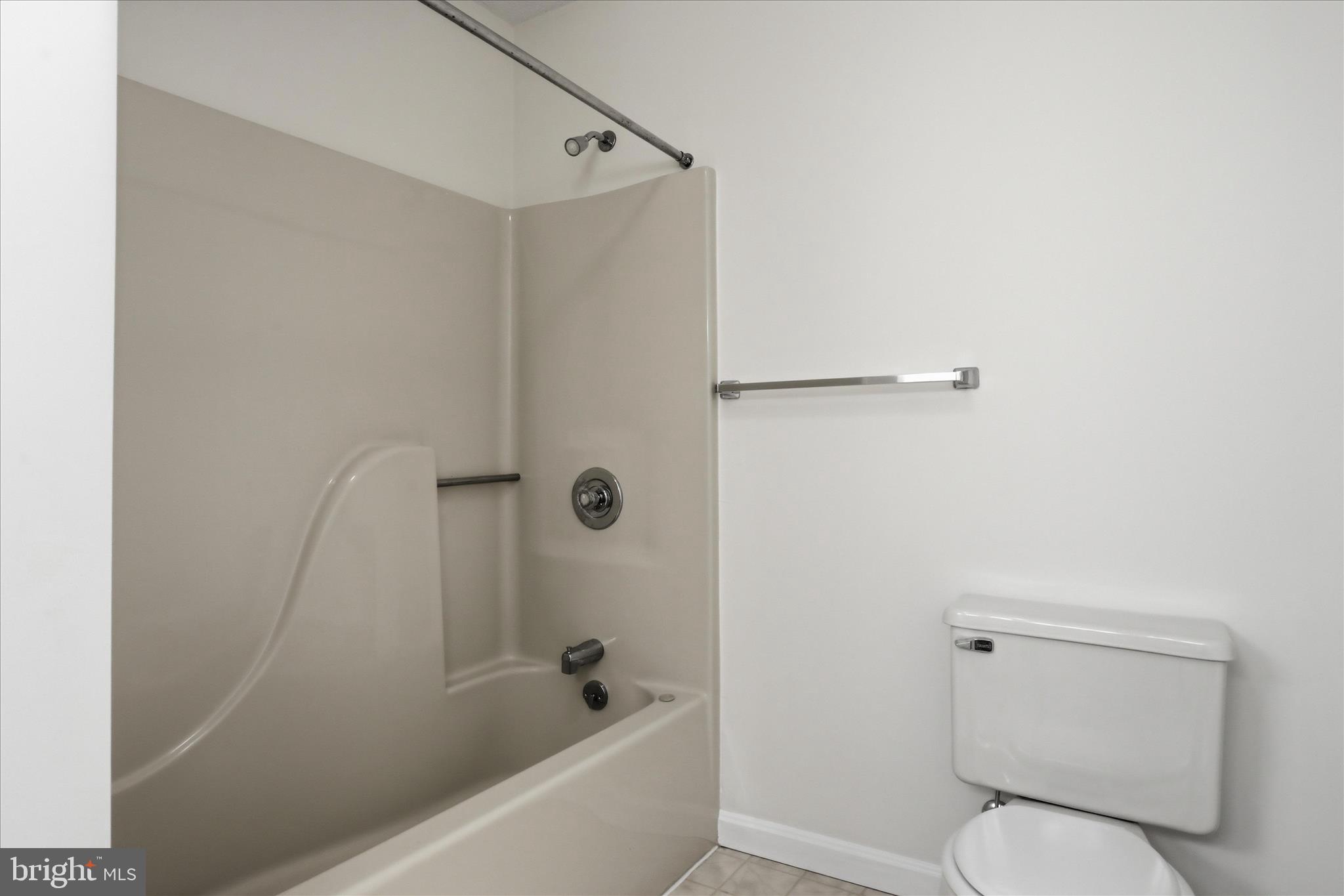 334 Stonegate Court Chambersburg, PA 17201 - Photo 16 of 25 a white toilet sitting next to a bath tub