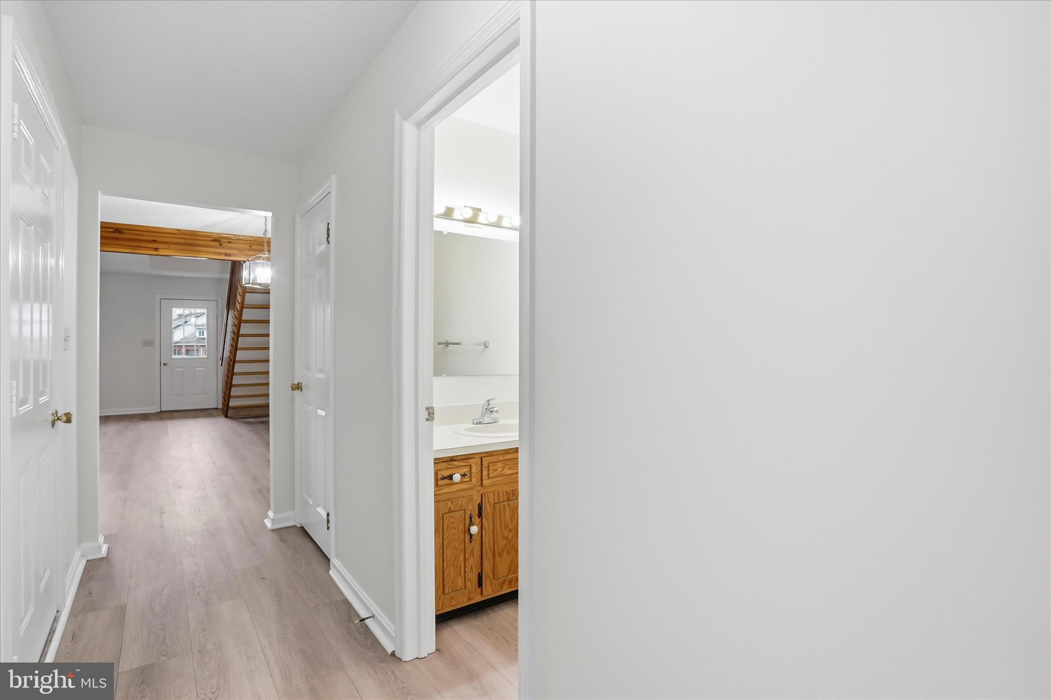 334 Stonegate Court Chambersburg, PA 17201 - Photo 3 of 25 an entryway and a hallway with wooden floor