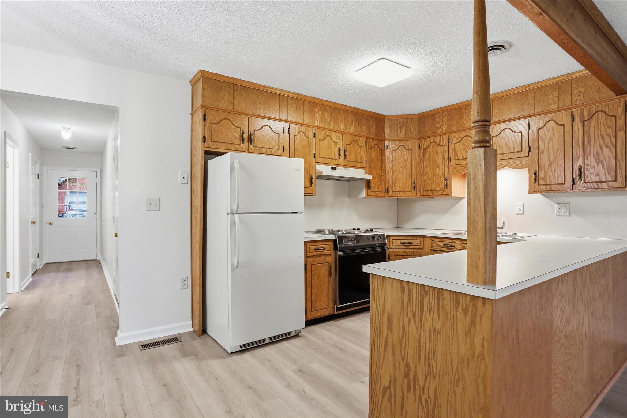 334 Stonegate Court Chambersburg, PA 17201 - Photo 4 of 25 a kitchen with stainless steel appliances granite countertop a refrigerator a sink and a stove