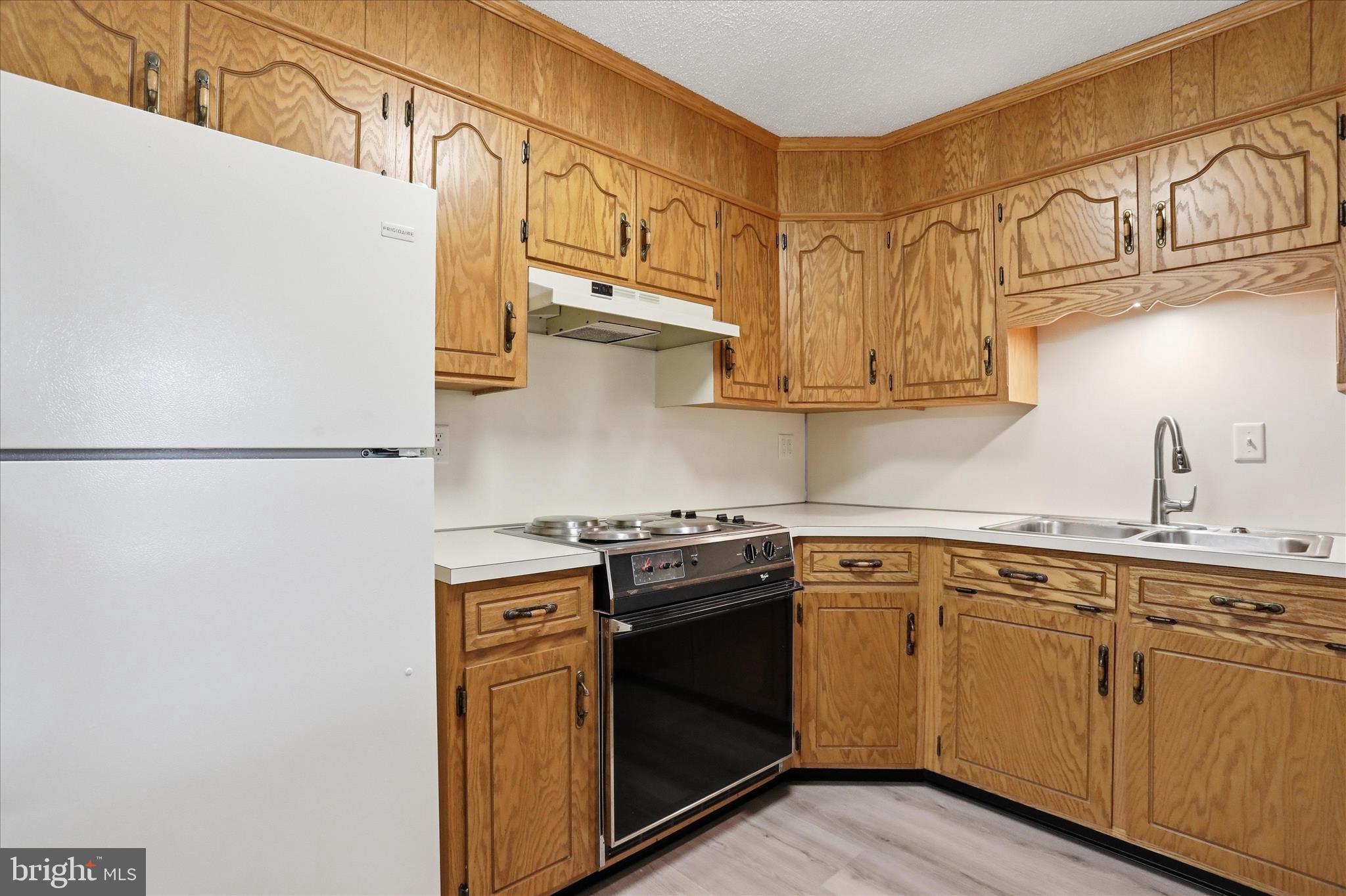 334 Stonegate Court Chambersburg, PA 17201 - Photo 6 of 25 a kitchen with stainless steel appliances granite countertop a sink and a stove