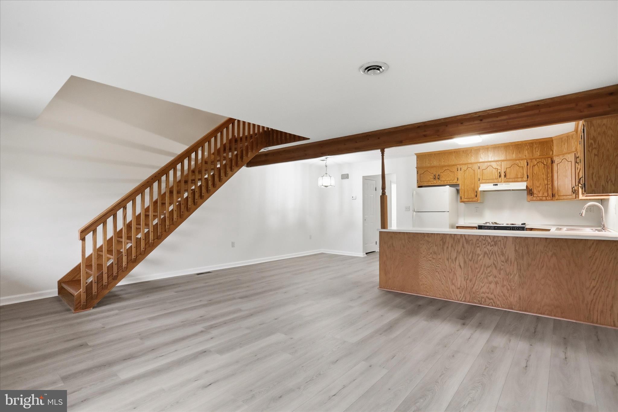 334 Stonegate Court Chambersburg, PA 17201 - Photo 25 of 25 a view of kitchen and hall with wooden floor