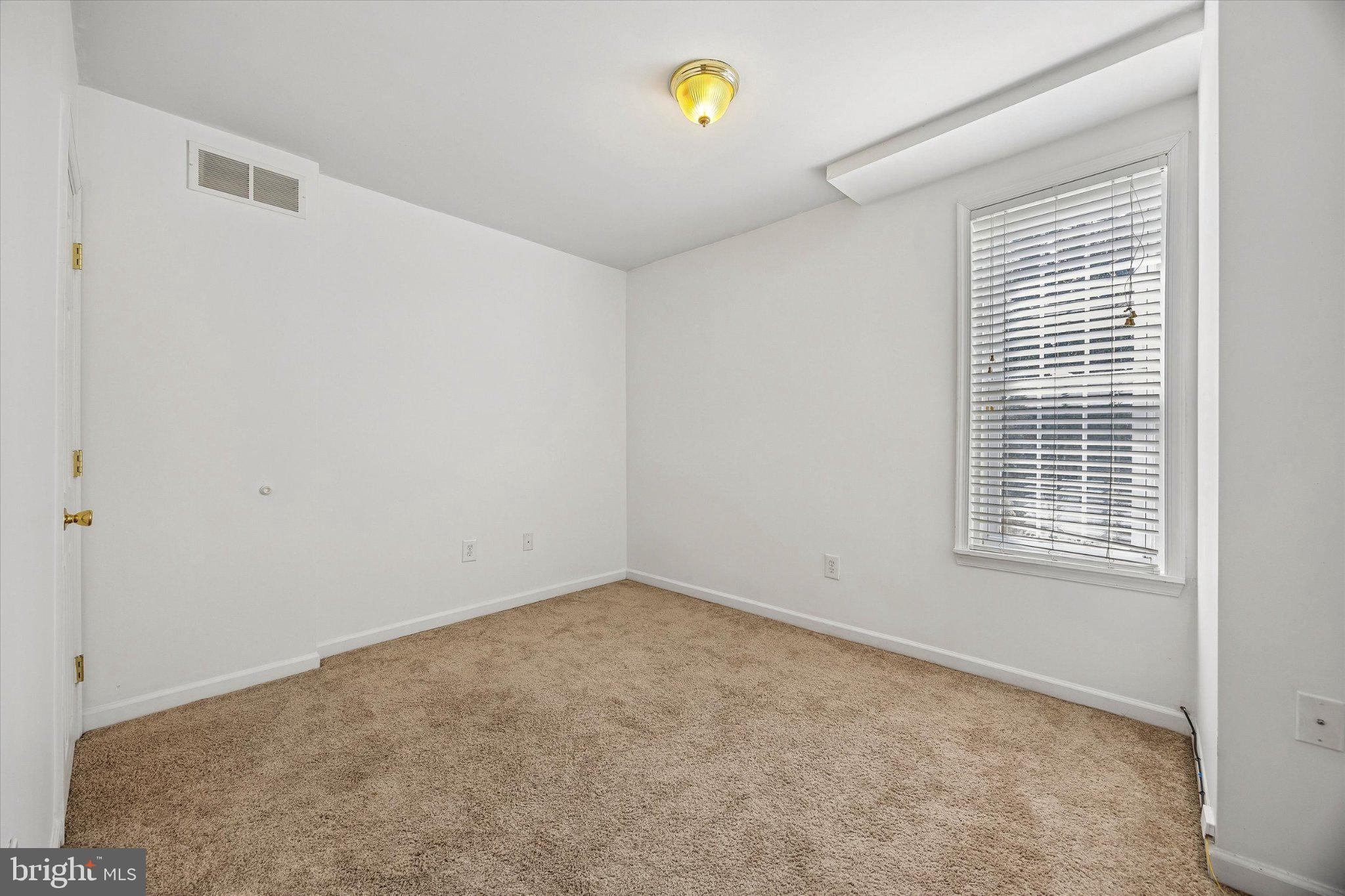 4334 Fleming Street Philadelphia, PA 19128 - Photo 18 of 25 a view of an empty room with a window