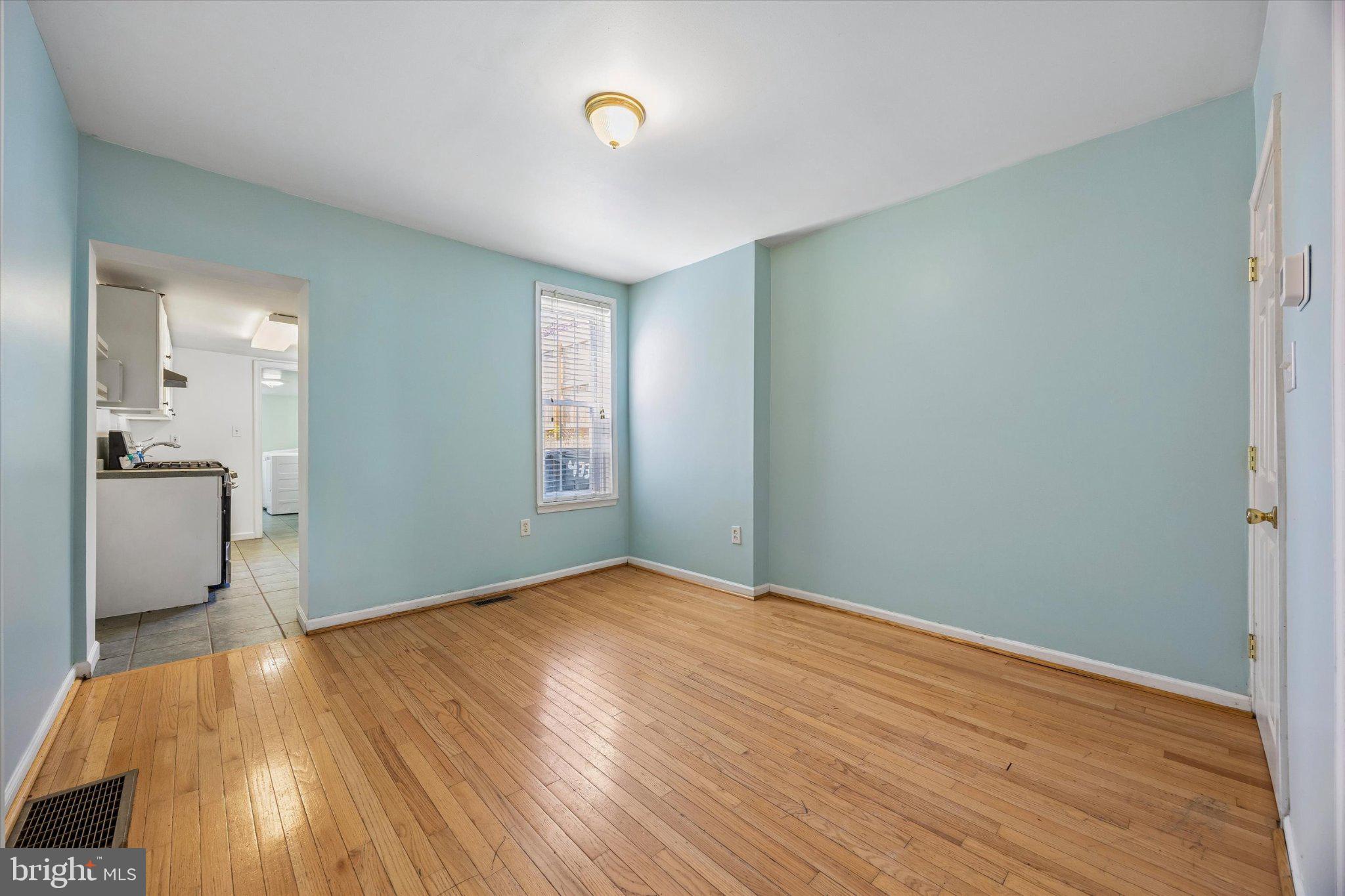 4334 Fleming Street Philadelphia, PA 19128 - Photo 8 of 25 an empty room with wooden floor and a bathroom