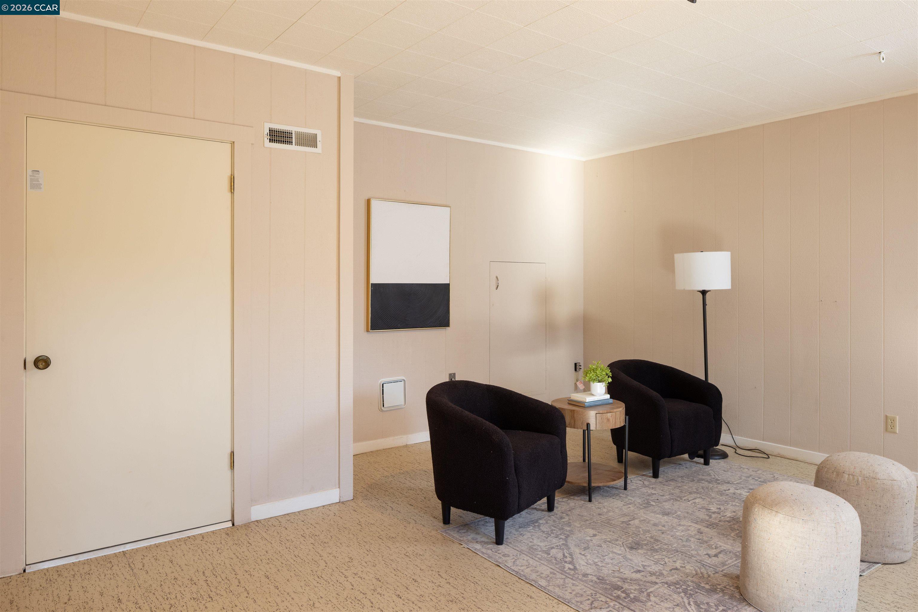 12 Marquard Road Carmel Valley, CA 93924 - Photo 25 of 36 a living room with furniture and a lamp