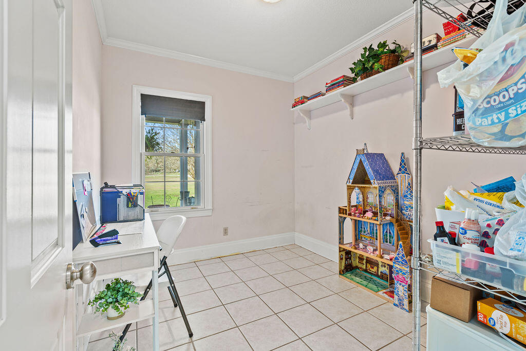 728 Otter Pond Road Westville, FL 32464 - Photo 17 of 39 a view of a entryway with furniture and toys