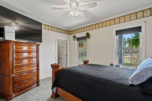 a bed room with a bed and a television
