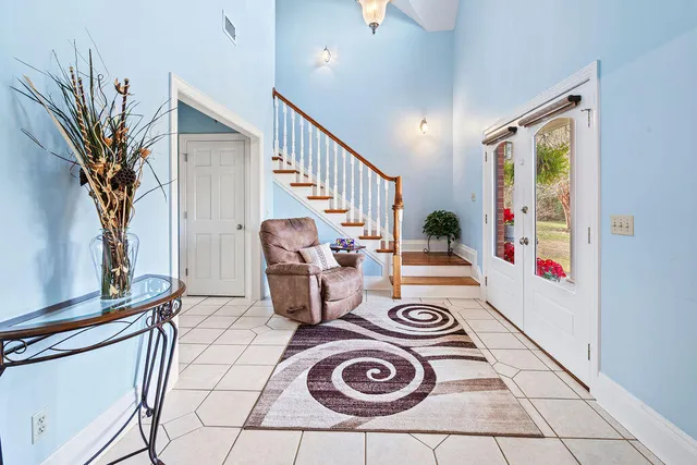 a view of entryway with workspace and a window