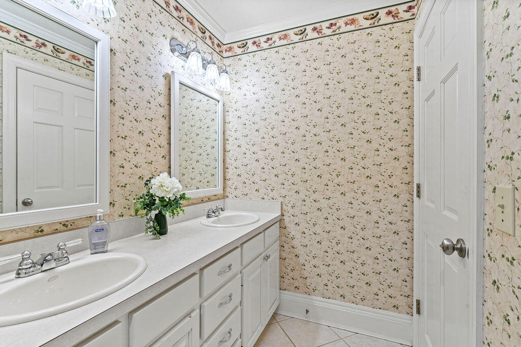 728 Otter Pond Road Westville, FL 32464 - Photo 32 of 39 a bathroom with a sink and a mirror