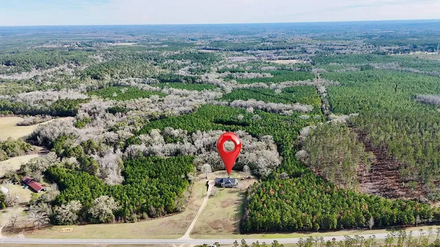 an aerial view of residential house and outdoor space