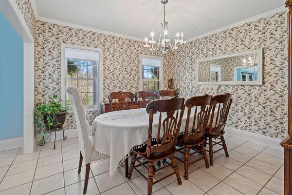 a view of a dining room with furniture window and outside view