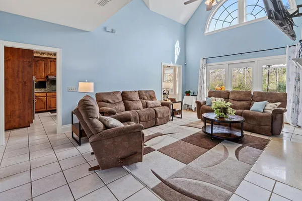 a living room with furniture and a window
