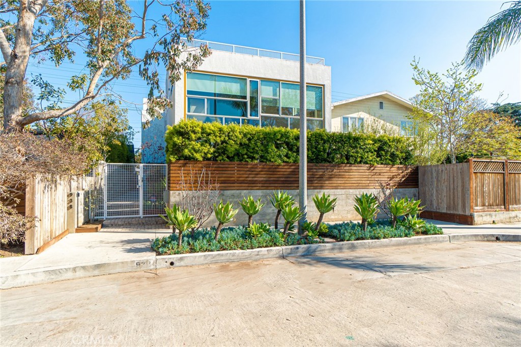 938 Palms Boulevard, Unit 2 Venice, CA 90291 - Photo 1 of 46 a view of a garden with a building in the background