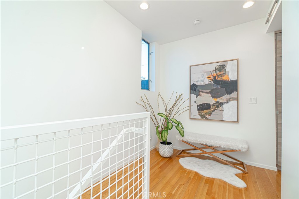 938 Palms Boulevard, Unit 2 Venice, CA 90291 - Photo 19 of 46 a bathroom with a granite countertop sink and a mirror