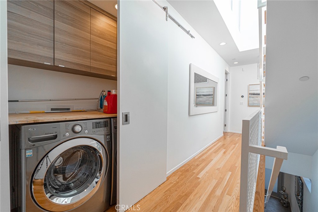 938 Palms Boulevard, Unit 2 Venice, CA 90291 - Photo 20 of 46 a view of a hallway with washer and dryer