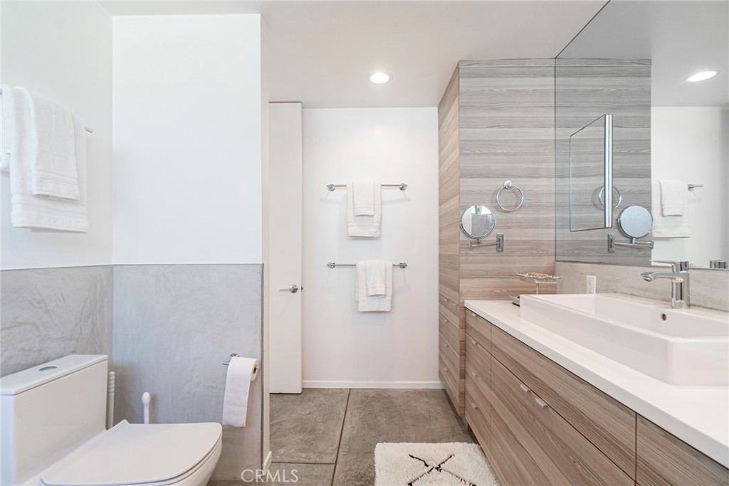 938 Palms Boulevard, Unit 2 Venice, CA 90291 - Photo 25 of 46 a bathroom with a sink a toilet and shower