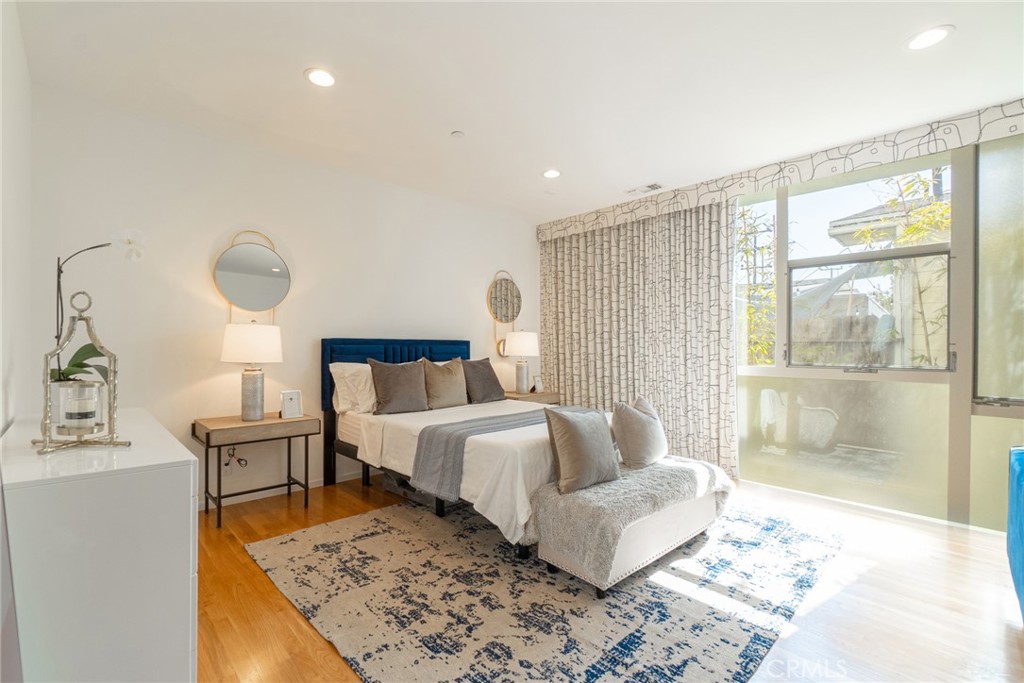 938 Palms Boulevard, Unit 2 Venice, CA 90291 - Photo 29 of 46 a spacious bedroom with a bed and window