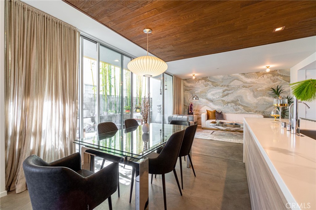 938 Palms Boulevard, Unit 2 Venice, CA 90291 - Photo 10 of 46 a dining room with furniture and floor to ceiling window