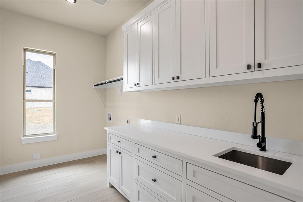 7637 County Road 1052 Celeste, TX 75423 - Photo 36 of 40 Washroom with cabinet space, plenty of natural light, washer hookup, light wood-style flooring, and recessed lighting