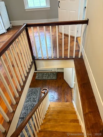 a view of a balcony with wooden floor