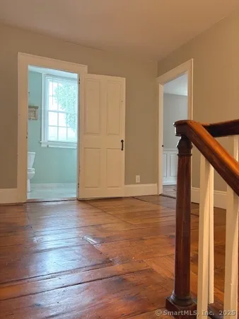 a bathroom with a shower and a toilet