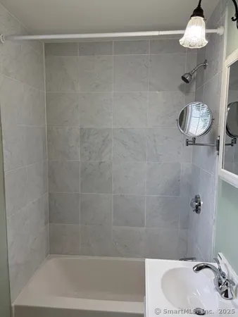 a bathroom with a toilet and a sink