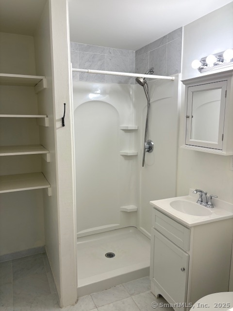 20 Riverview Road Rocky Hill, CT 06067 - Photo 28 of 35 a bathroom with a shower sink vanity and mirror