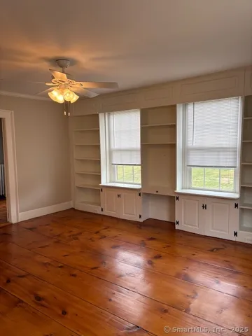 a view of staircase with wooden floor