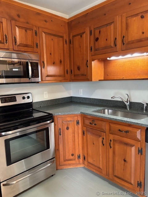 20 Riverview Road Rocky Hill, CT 06067 - Photo 6 of 35 a kitchen with stainless steel appliances granite countertop a stove microwave and cabinets